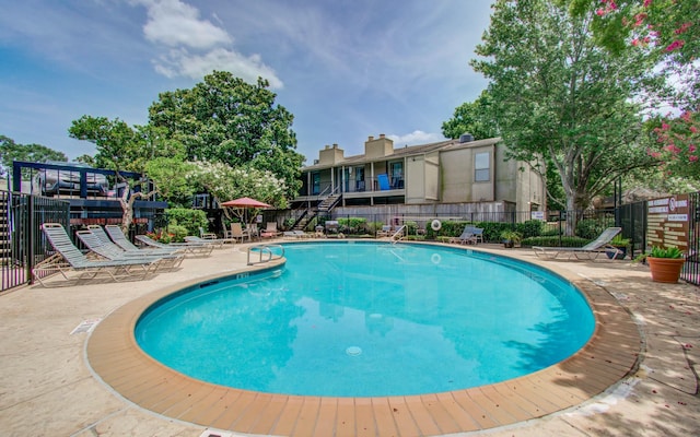 5711 Sugar Hill Dr Unit 108, Houston, TX 77057 - community pool featuring a patio area and stairs