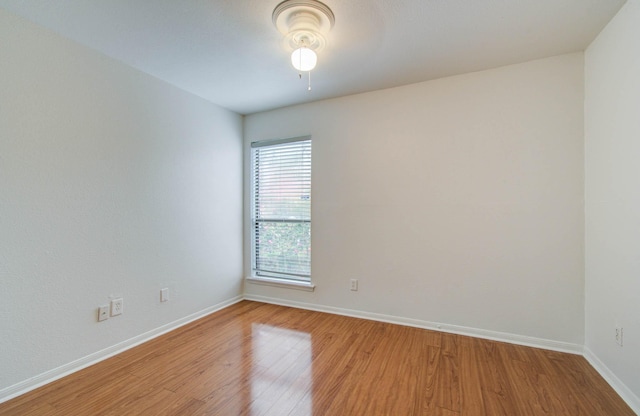 5711 Sugar Hill Dr Unit 108, Houston, TX 77057 - spare room with wood finished floors and a ceiling fan