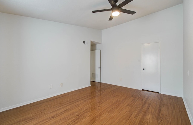 5711 Sugar Hill Dr Unit 108, Houston, TX 77057 - empty room with a ceiling fan, wood finished floors, and lofted ceiling