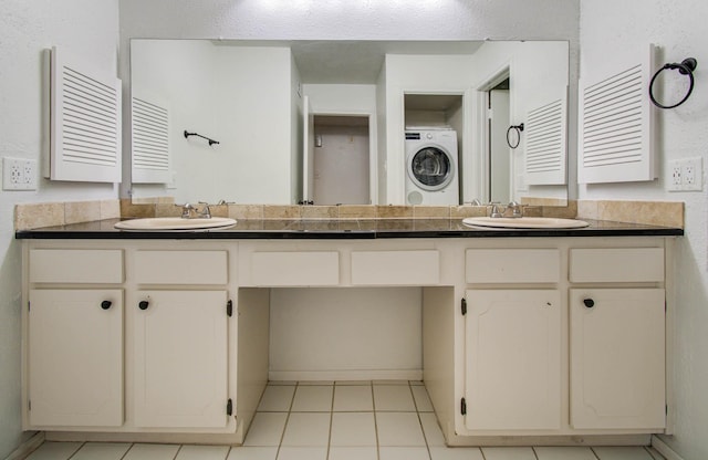 5711 Sugar Hill Dr Unit 108, Houston, TX 77057 - full bathroom featuring double vanity, tile patterned floors, and stacked washer / drying machine