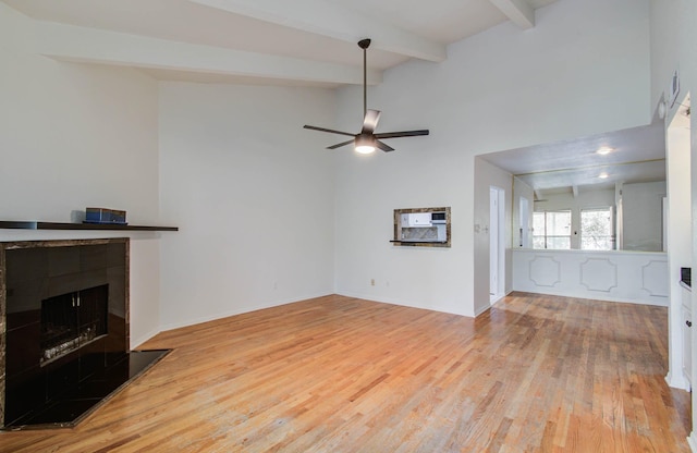 5711 Sugar Hill Dr Unit 108, Houston, TX 77057 - unfurnished living room with wood finished floors, a fireplace, and a ceiling fan