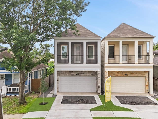 1109 Robbie St, Houston, TX 77009 - view of front of property featuring stone siding, driveway, an attached garage, and a shingled roof