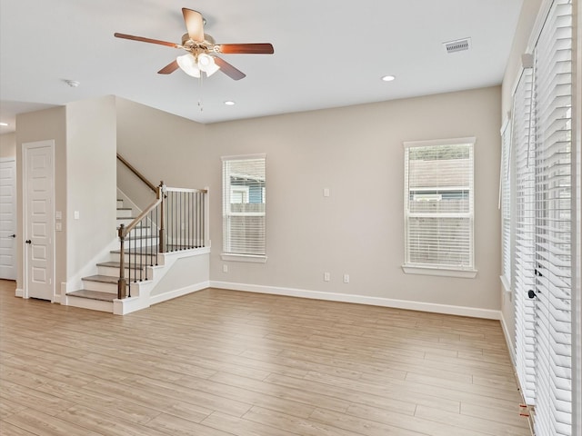 1109 Robbie St, Houston, TX 77009 - unfurnished living room with a ceiling fan, stairway, healthy amount of natural light, light wood-style floors, and recessed lighting
