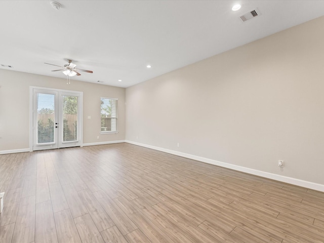 1109 Robbie St, Houston, TX 77009 - empty room featuring a ceiling fan, a smoke detector, light wood finished floors, and recessed lighting