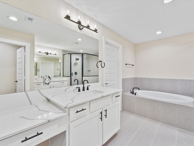 1109 Robbie St, Houston, TX 77009 - full bathroom featuring vanity, a bath, a stall shower, tile patterned floors, and recessed lighting