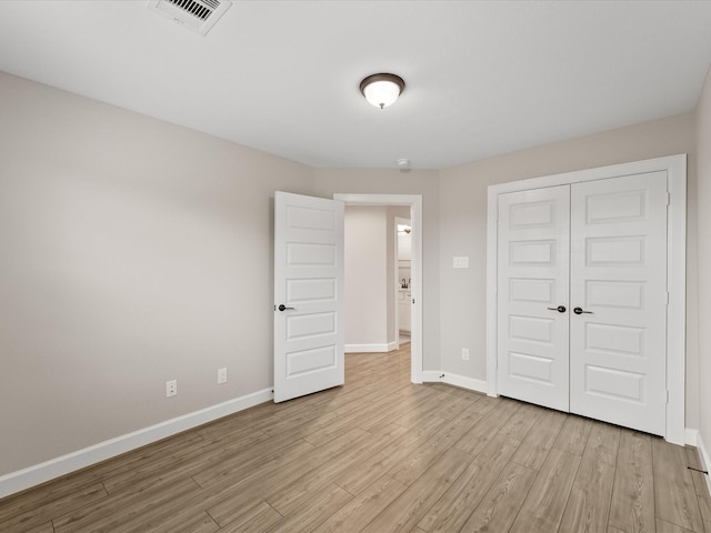 1109 Robbie St, Houston, TX 77009 - unfurnished bedroom with light wood-type flooring and a closet