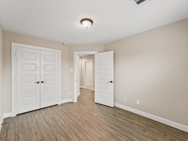 1109 Robbie St, Houston, TX 77009 - unfurnished bedroom with a closet and light wood-type flooring