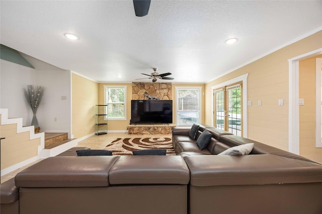 478 Brandon Rd, Conroe, TX 77302 - living area featuring ceiling fan, recessed lighting, a stone fireplace, and a textured ceiling