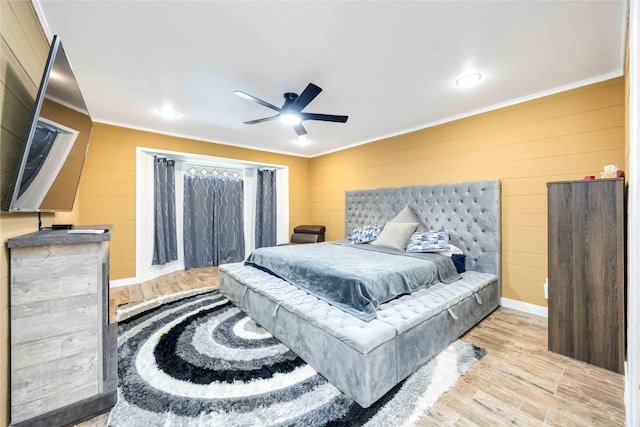 478 Brandon Rd, Conroe, TX 77302 - bedroom with crown molding, wood finished floors, wooden walls, a ceiling fan, and recessed lighting