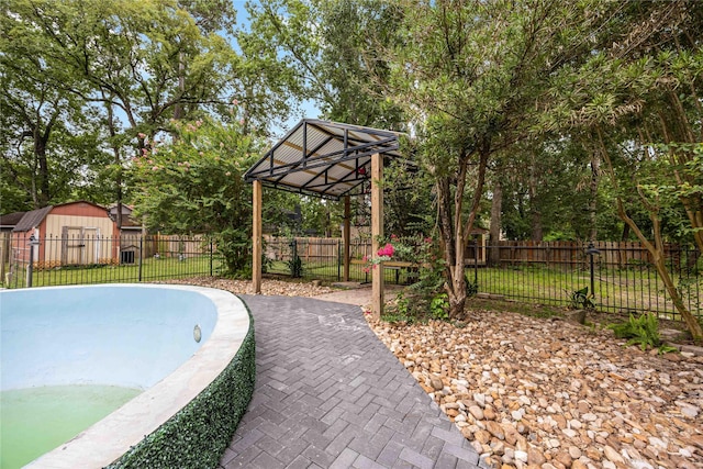478 Brandon Rd, Conroe, TX 77302 - view of pool featuring a gazebo, a storage shed, and a fenced backyard