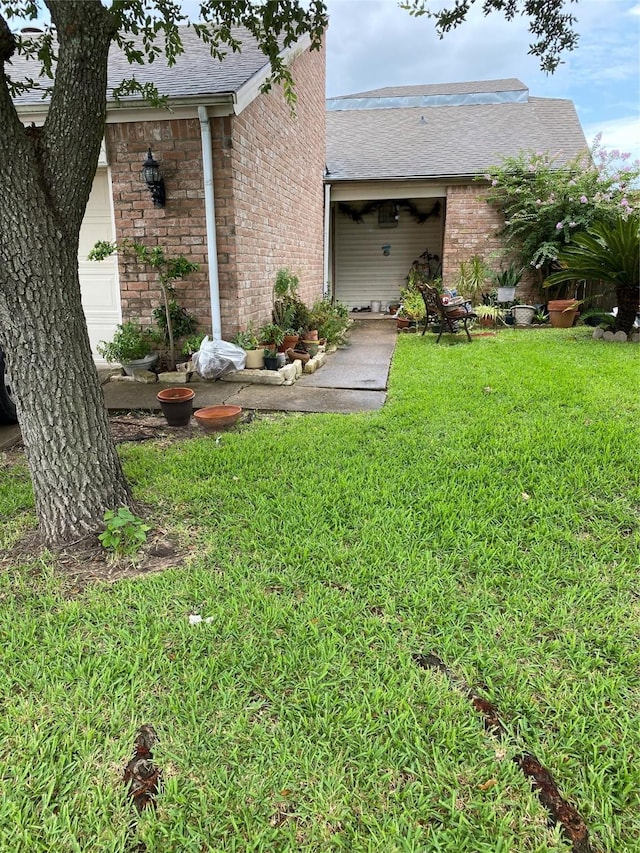 4410 Wildacres Dr, Houston, TX 77072 - view of front of home with brick siding, a front lawn, and a shingled roof