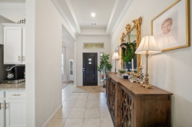 14510 Kasey Flowers Ct, Humble, TX 77396 - foyer featuring light tile patterned floors, crown molding, and a raised ceiling