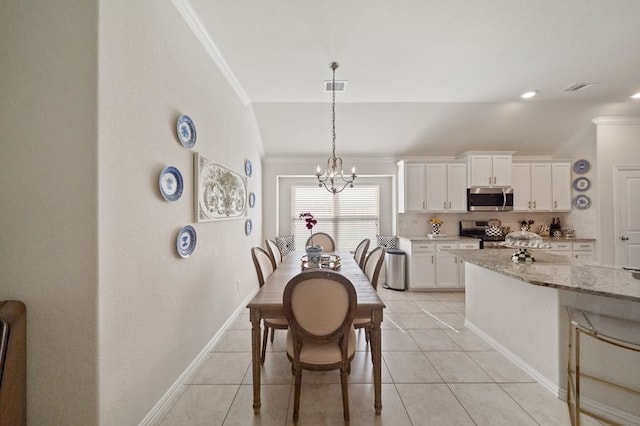 14510 Kasey Flowers Ct, Humble, TX 77396 - dining area with ornamental molding, a chandelier, and light tile patterned floors