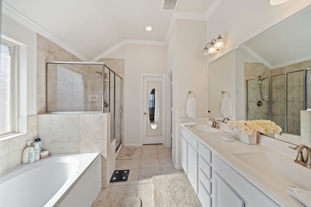 14510 Kasey Flowers Ct, Humble, TX 77396 - full bath with healthy amount of natural light, a stall shower, a bath, double vanity, and vaulted ceiling