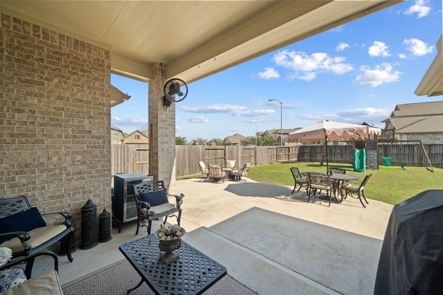14510 Kasey Flowers Ct, Humble, TX 77396 - fenced backyard with a playground, a patio area, grilling area, and outdoor dining space