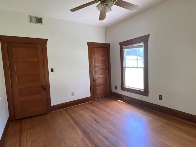 222 N 1st, Wallis, TX 77485 - spare room with hardwood / wood-style floors and a ceiling fan