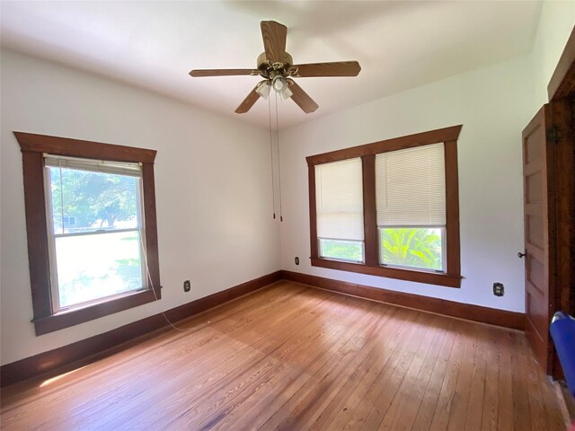 222 N 1st, Wallis, TX 77485 - spare room featuring hardwood / wood-style flooring and a ceiling fan