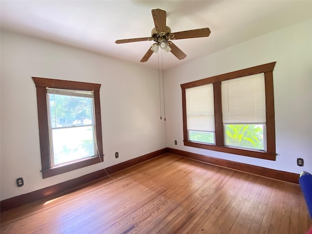 222 N 1st, Wallis, TX 77485 - unfurnished room featuring hardwood / wood-style floors and a ceiling fan