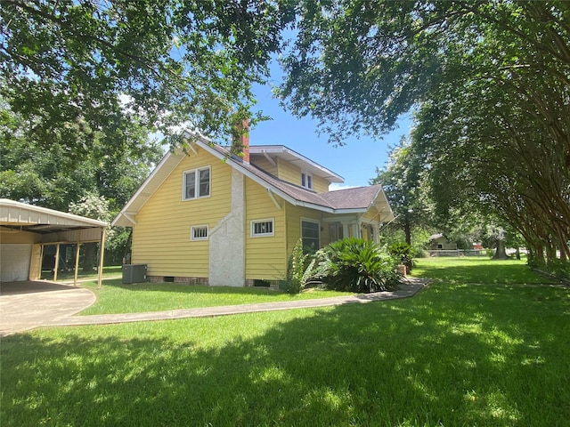 222 N 1st, Wallis, TX 77485 - view of home's exterior featuring a lawn and a chimney