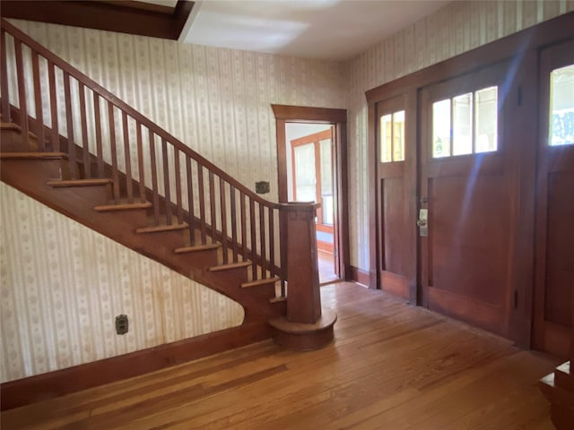 222 N 1st, Wallis, TX 77485 - foyer entrance featuring wood-type flooring, wallpapered walls, and stairs