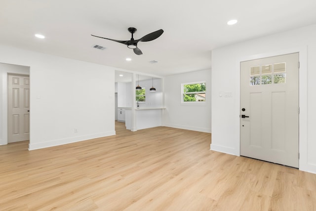 2307 Scott St, La Marque, TX 77568 - unfurnished living room featuring a ceiling fan, recessed lighting, and light wood-style flooring