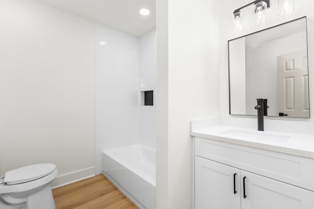 2307 Scott St, La Marque, TX 77568 - bathroom with vanity, wood finished floors, recessed lighting, and shower / bathtub combination