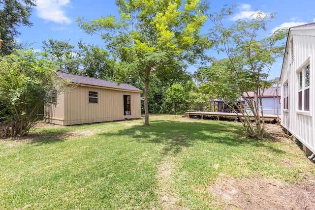 2307 Scott St, La Marque, TX 77568 - view of green lawn featuring an outbuilding