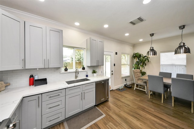 2014 Fisher Trace Ct, Spring, TX 77373 - kitchen with gray cabinets, stainless steel dishwasher, ornamental molding, backsplash, and dark wood-style flooring