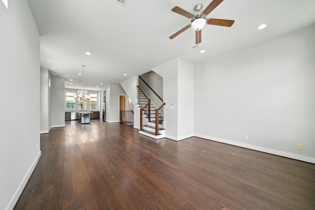 151 E 2nd St, Houston, TX 77007 - unfurnished living room featuring a chandelier, stairs, dark wood-type flooring, a ceiling fan, and recessed lighting