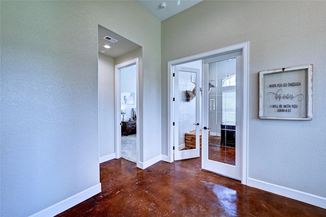 3403 Westhaven Ct, Fulshear, TX 77441 - hallway with concrete flooring and french doors