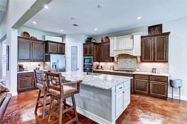 3403 Westhaven Ct, Fulshear, TX 77441 - kitchen featuring appliances with stainless steel finishes, finished concrete flooring, decorative backsplash, a kitchen breakfast bar, and recessed lighting