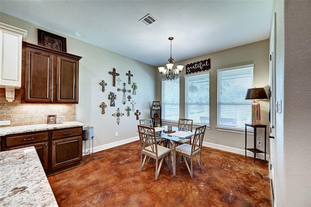 3403 Westhaven Ct, Fulshear, TX 77441 - dining space featuring concrete flooring and a chandelier