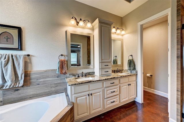 3403 Westhaven Ct, Fulshear, TX 77441 - full bath featuring double vanity, concrete floors, a garden tub, and a textured wall