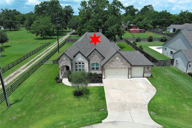 3403 Westhaven Ct, Fulshear, TX 77441 - view of front facade featuring stone siding, a garage, driveway, and a chimney