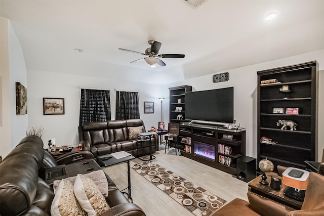 826 Green Clover Ln, Rosharon, TX 77583 - living area featuring ceiling fan, light wood finished floors, and a glass covered fireplace