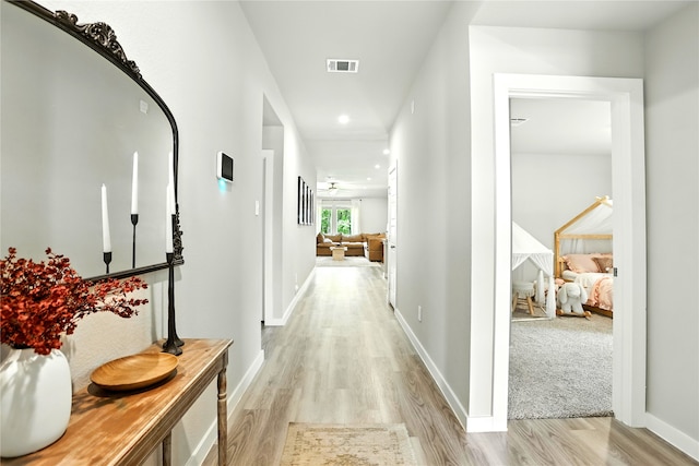 621 Little Spring Ct, Anahuac, TX 77514 - hallway with light wood-style flooring and recessed lighting