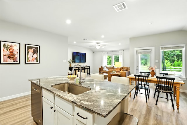 621 Little Spring Ct, Anahuac, TX 77514 - kitchen featuring dishwasher, recessed lighting, light wood-style flooring, a ceiling fan, and a kitchen island with sink