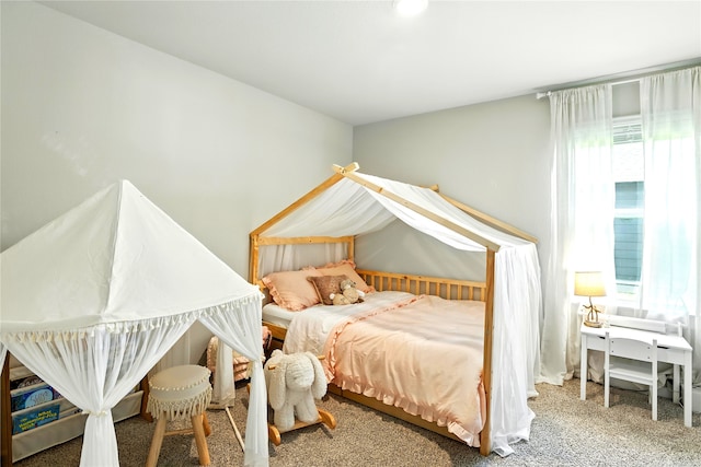 621 Little Spring Ct, Anahuac, TX 77514 - bedroom featuring multiple windows and carpet