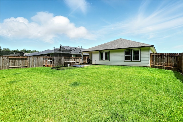 621 Little Spring Ct, Anahuac, TX 77514 - back of house with a fenced backyard and a patio