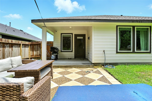 621 Little Spring Ct, Anahuac, TX 77514 - entrance to property with a patio and an outdoor hangout area