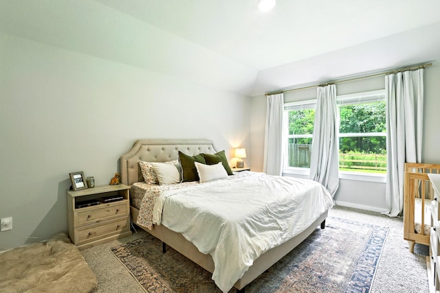 621 Little Spring Ct, Anahuac, TX 77514 - carpeted bedroom featuring vaulted ceiling and baseboards