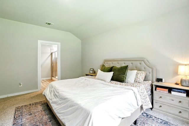 621 Little Spring Ct, Anahuac, TX 77514 - bedroom featuring vaulted ceiling and light carpet