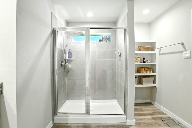 621 Little Spring Ct, Anahuac, TX 77514 - full bathroom with a stall shower and wood finished floors