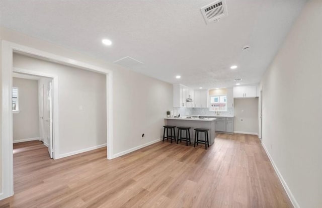 202 Sylvia St, Deer Park, TX 77536 - living area featuring light wood-style flooring and recessed lighting