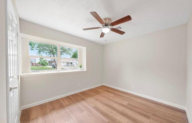 202 Sylvia St, Deer Park, TX 77536 - spare room with light wood-style floors and a ceiling fan