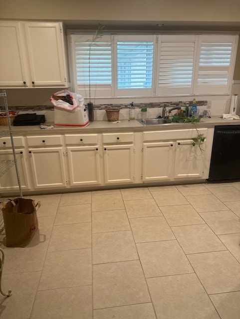 7955 Fawn Terrace Dr, Houston, TX 77071 - kitchen with dishwasher, white cabinetry, light tile patterned floors, and light countertops