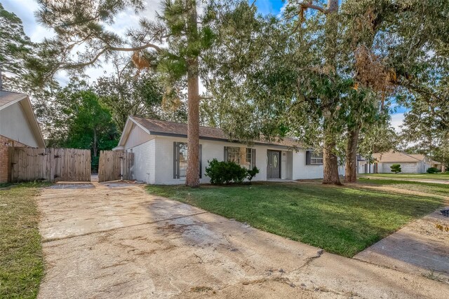 23131 Earlmist Dr, Spring, TX 77373 - ranch-style home with a gate, concrete driveway, and brick siding