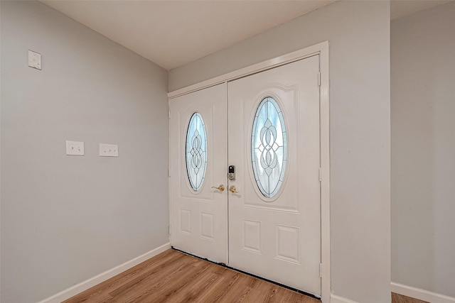 23131 Earlmist Dr, Spring, TX 77373 - entryway with baseboards and light wood-type flooring