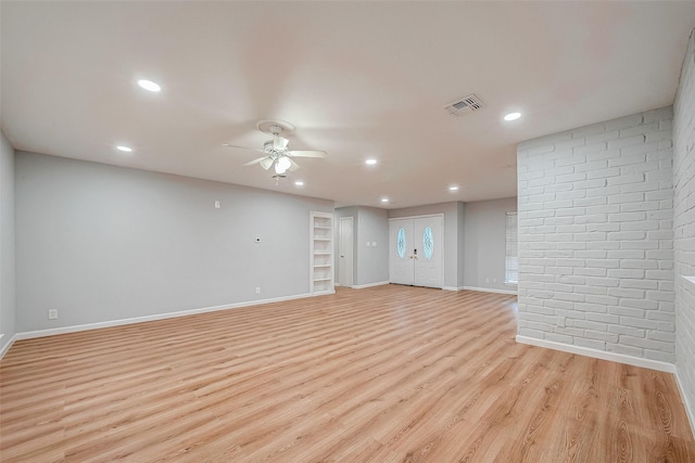 23131 Earlmist Dr, Spring, TX 77373 - unfurnished room with ceiling fan, light wood-style flooring, recessed lighting, and brick wall