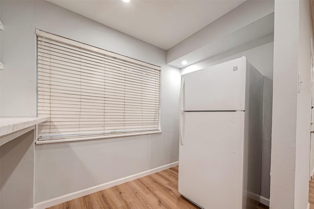 23131 Earlmist Dr, Spring, TX 77373 - kitchen featuring freestanding refrigerator, wood finished floors, and recessed lighting